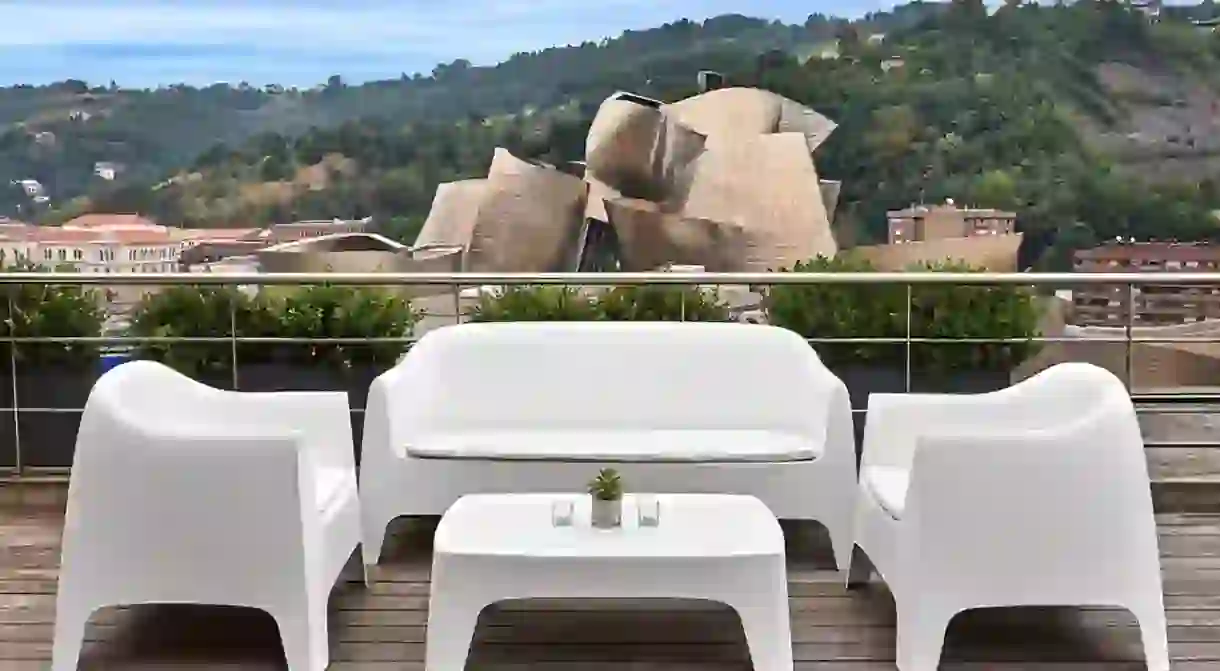 Overlook the most famous site in Bilbao, Frank Gehrys Guggenheim, from your hotel rooftop