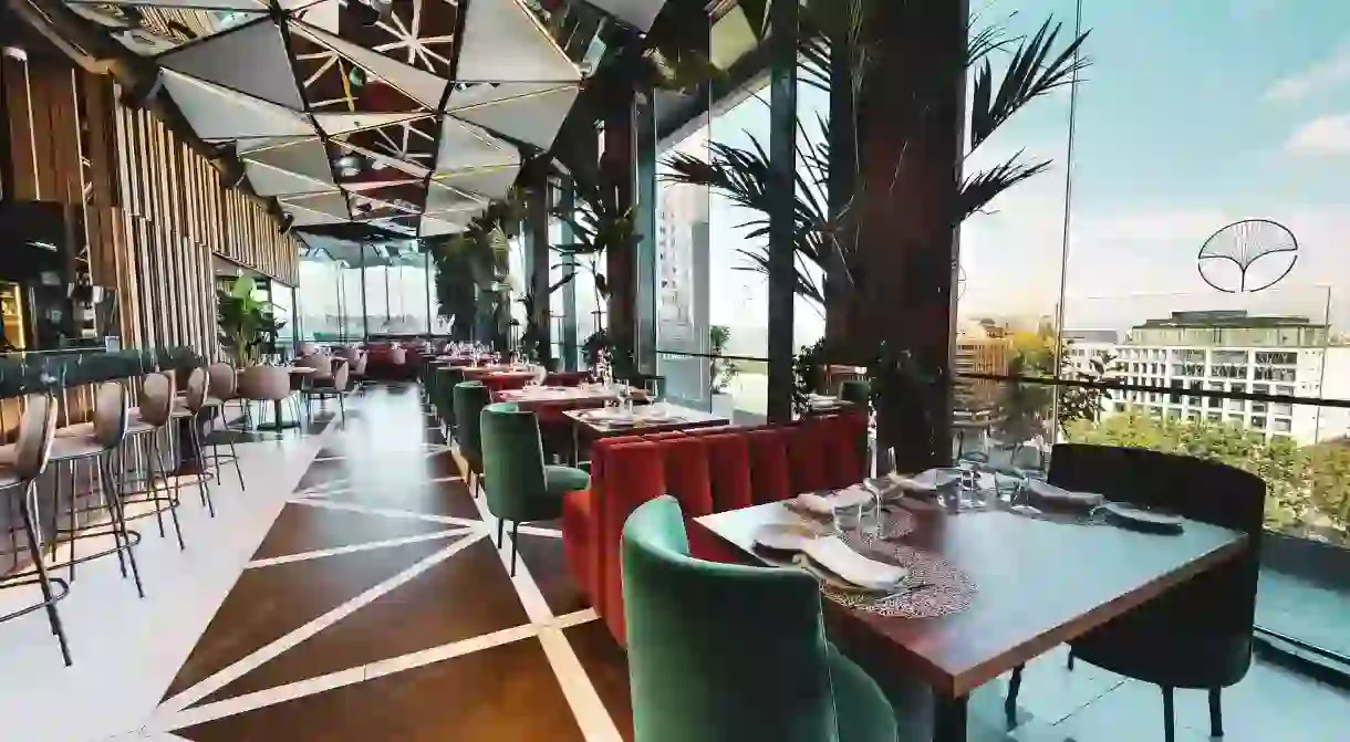 Bask in panoramic views across the city from a 12th-floor restaurant and bar