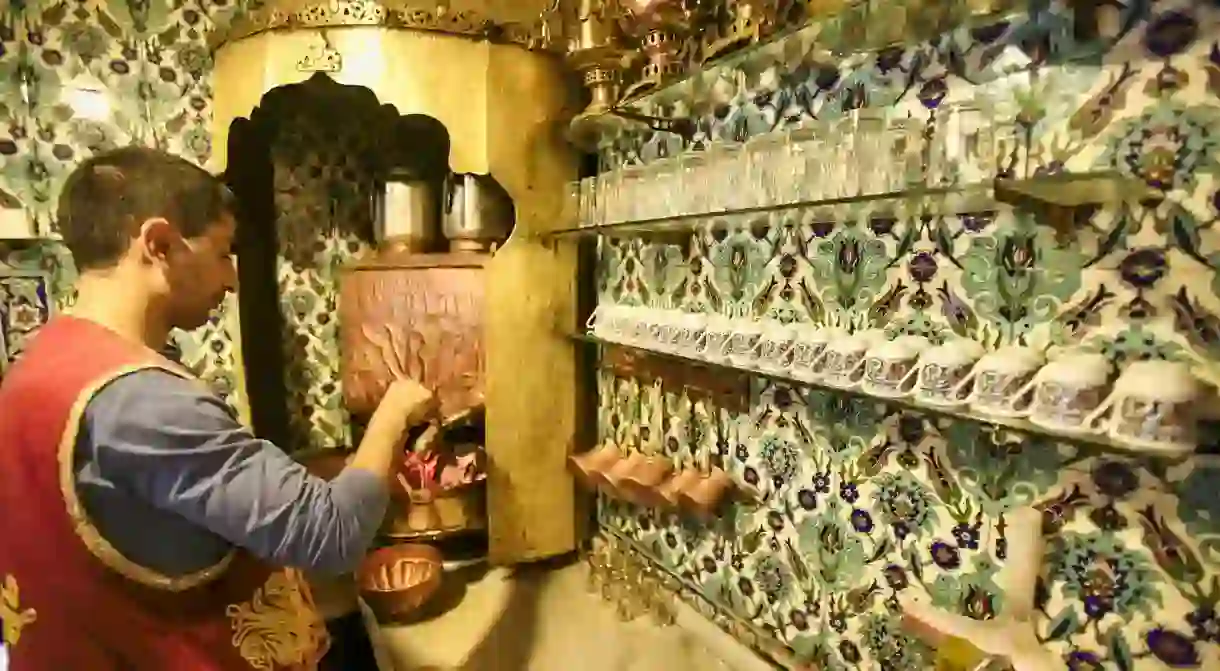 A waiter prepares Turkish coffees in the kitchen of Pierre Loti Cafe, Eyup, Istanbul, Turkey