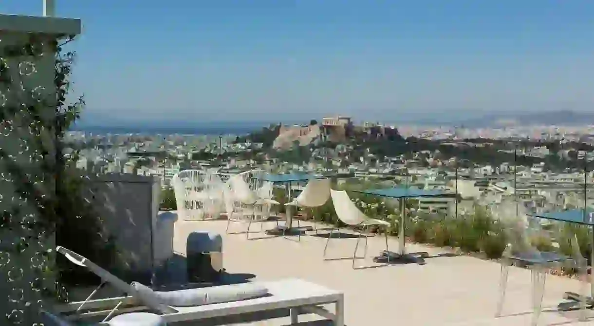 See far beyond Athens, all the way out to the Saronic Islands, from your hotel rooftop