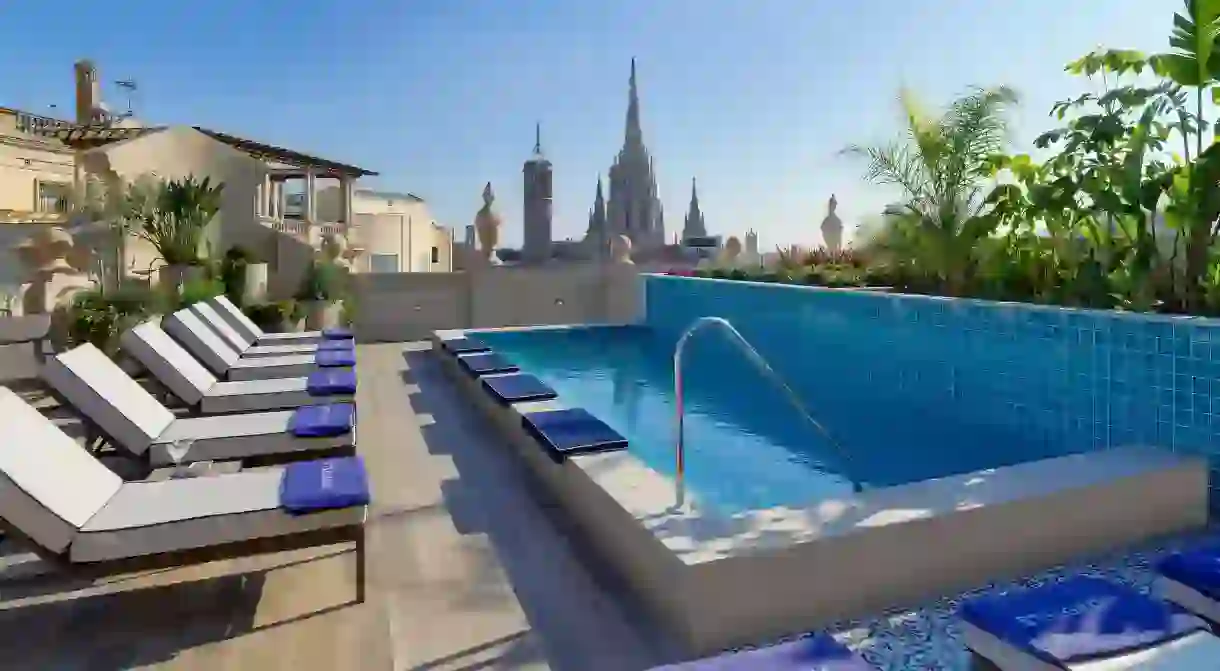 Recline above the cityscape at your very own rooftop pool