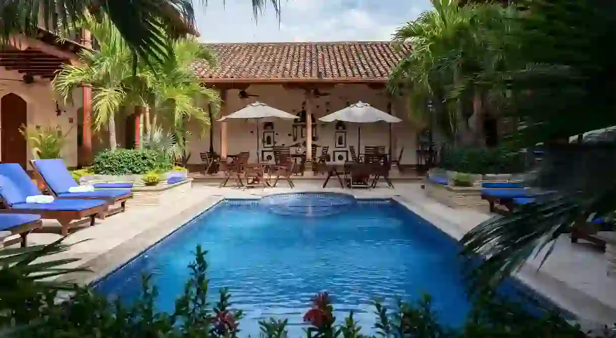 Relax by the pool at Hotel Plaza Colon in Granada, Nicaragua