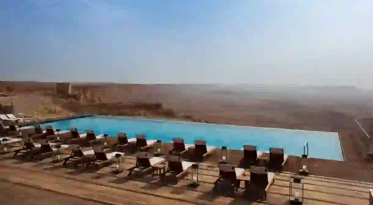 Soak up views of the Ramon Crater and Negev Desert while relaxing in the pool at Beresheet Hotel