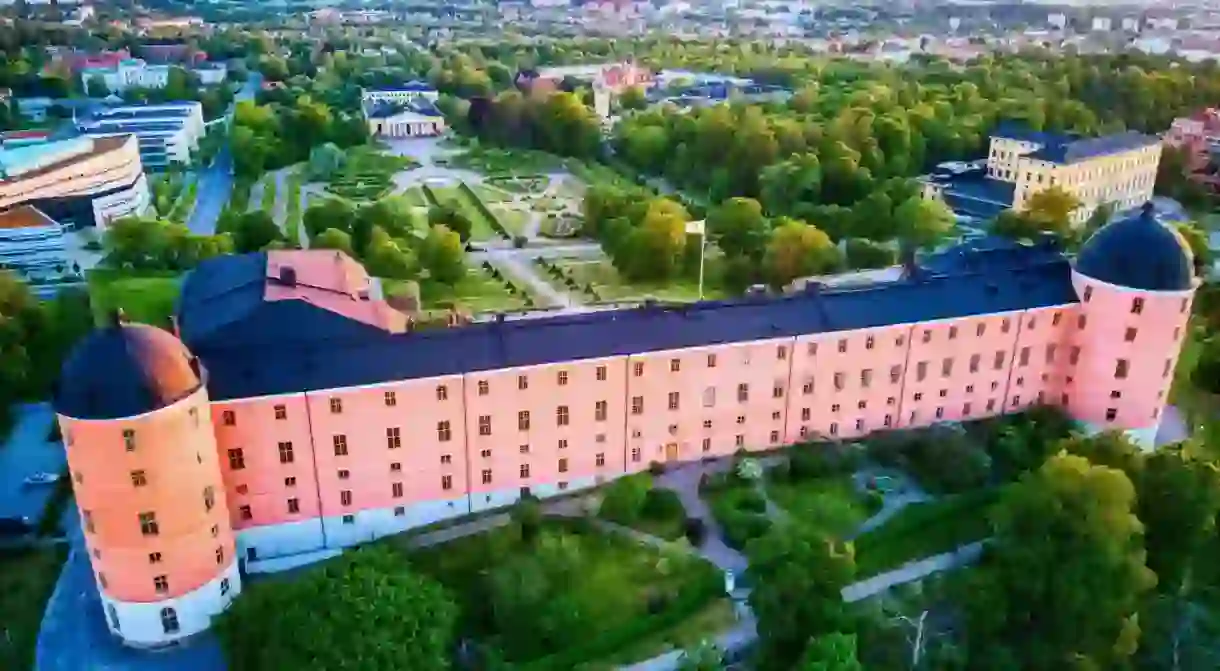 Uppsala Castle dominates its surroundings with its unmissable peach-coloured facade