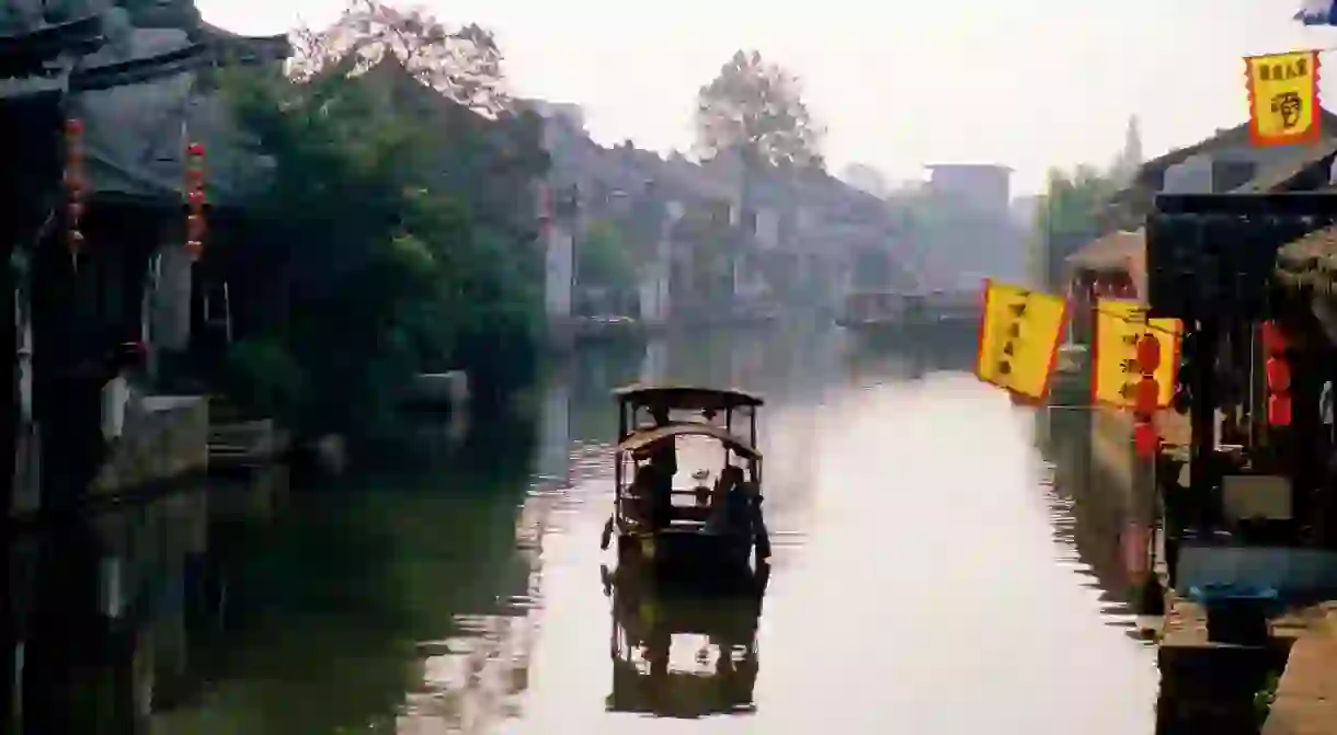 Ancient water town boat on a canal location for film Mission Impossible III, Xitang, Zhejiang, China