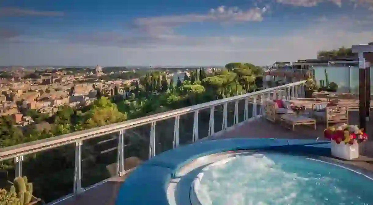 Take a dip in a rooftop jacuzzi at Rome Cavalieri with amazing views over the Eternal City