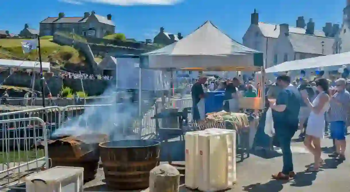 Foodies queue for their Arbroath smokies at the Portsoy Festival in Aberdeenshire