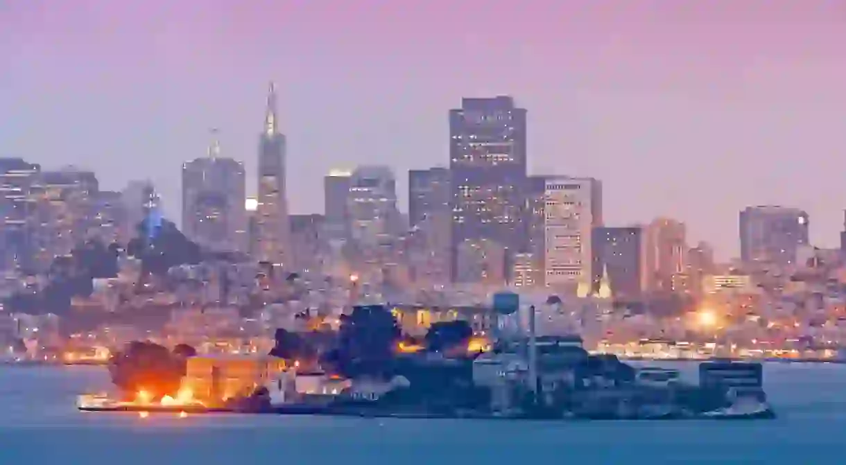 The notorious maximum-security prison Alcatraz at night, with San Francisco in the background