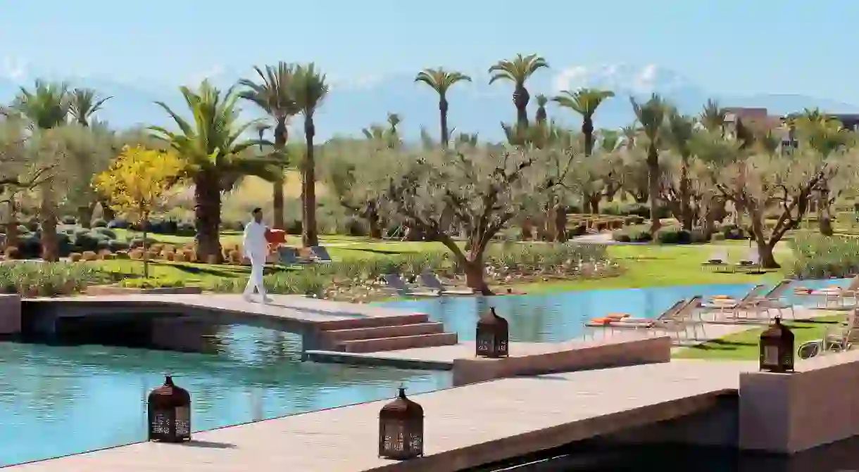 The Fairmont Royal Palm Marrakech offers luxury amenities in view of the Atlas Mountains