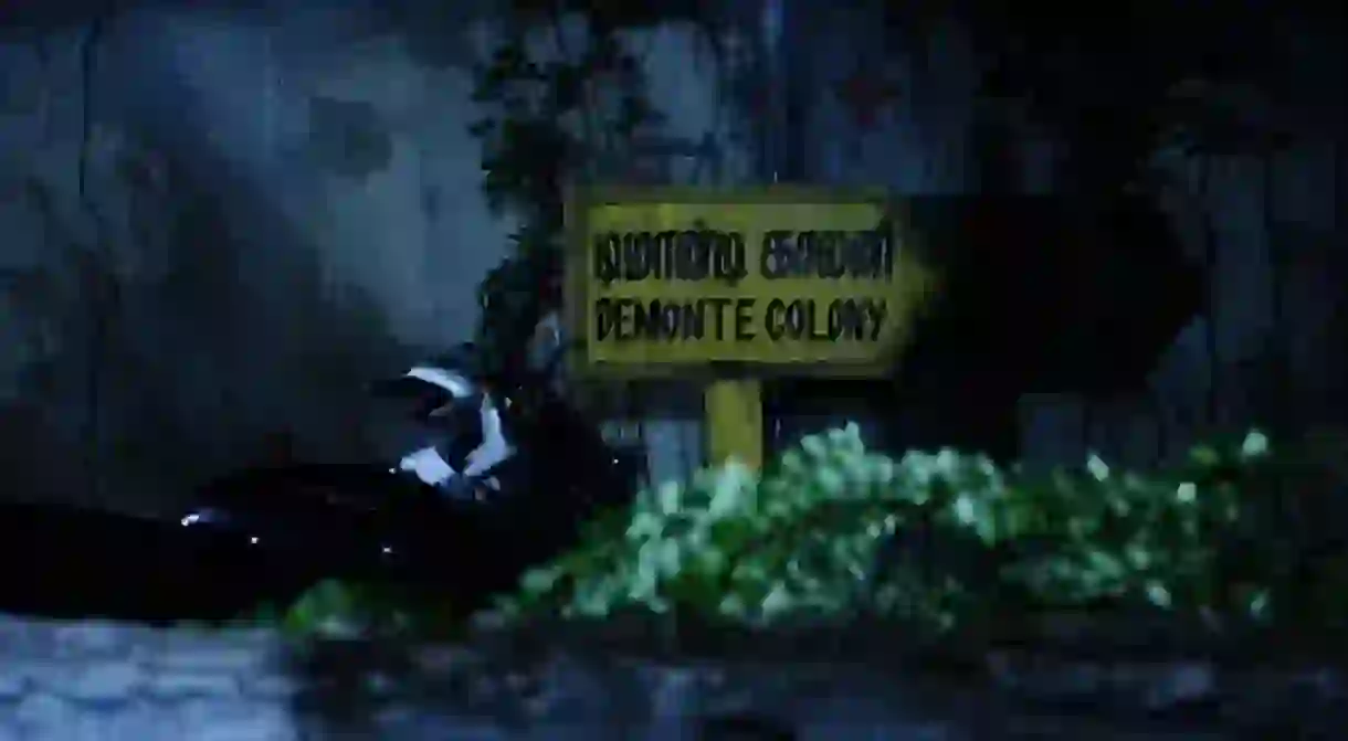 A group of friends explore a haunted mansion in the 2015 film Demonte Colony