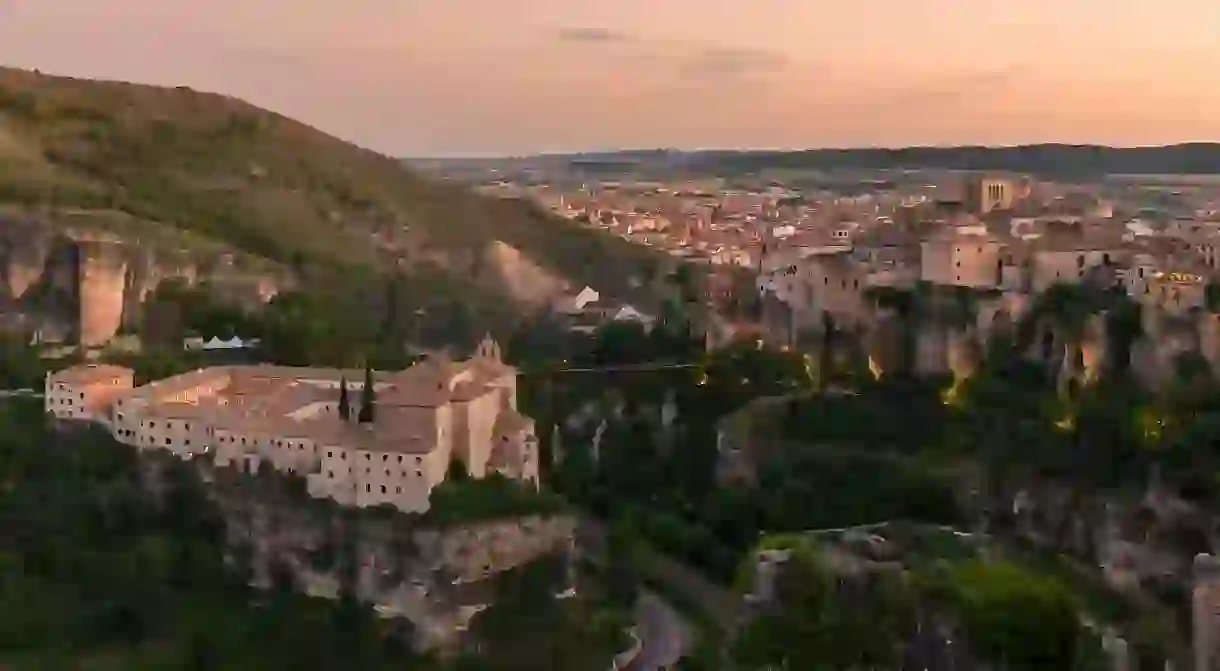 Sunset over the cliff-top buildings of Cuenca, including the Convento de San Pablo, now the Parador de Cuenca in Castilla-La Mancha