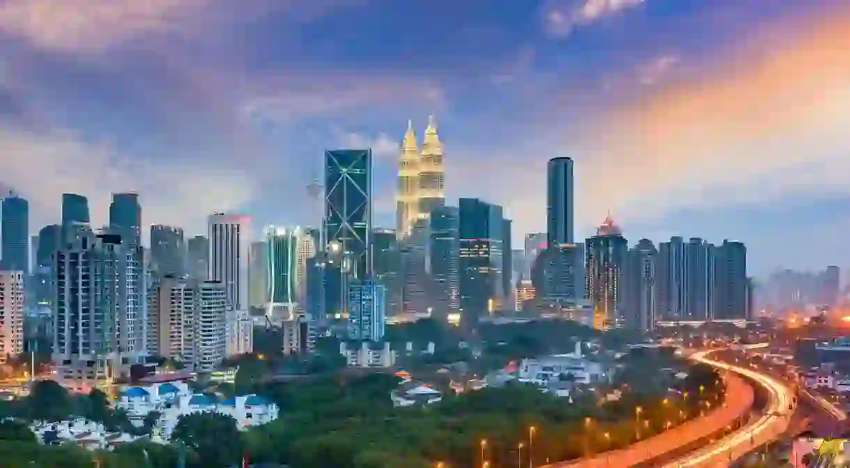 A panoramic view of Kuala Lumpur, Malaysia, including the iconic Petronas Twin Towers