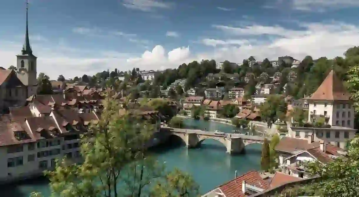 The view across the Aare River, the Untertorbrucke bridge and the Old Town of Bern, Switzerland