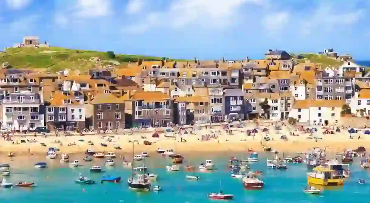 Take a dip in St Ives bay, Cornwall, with its pretty fishing boats