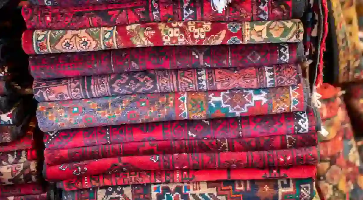 Traditional Iranian carpets are made with natural dyes, so look for colours that seem to come from nature