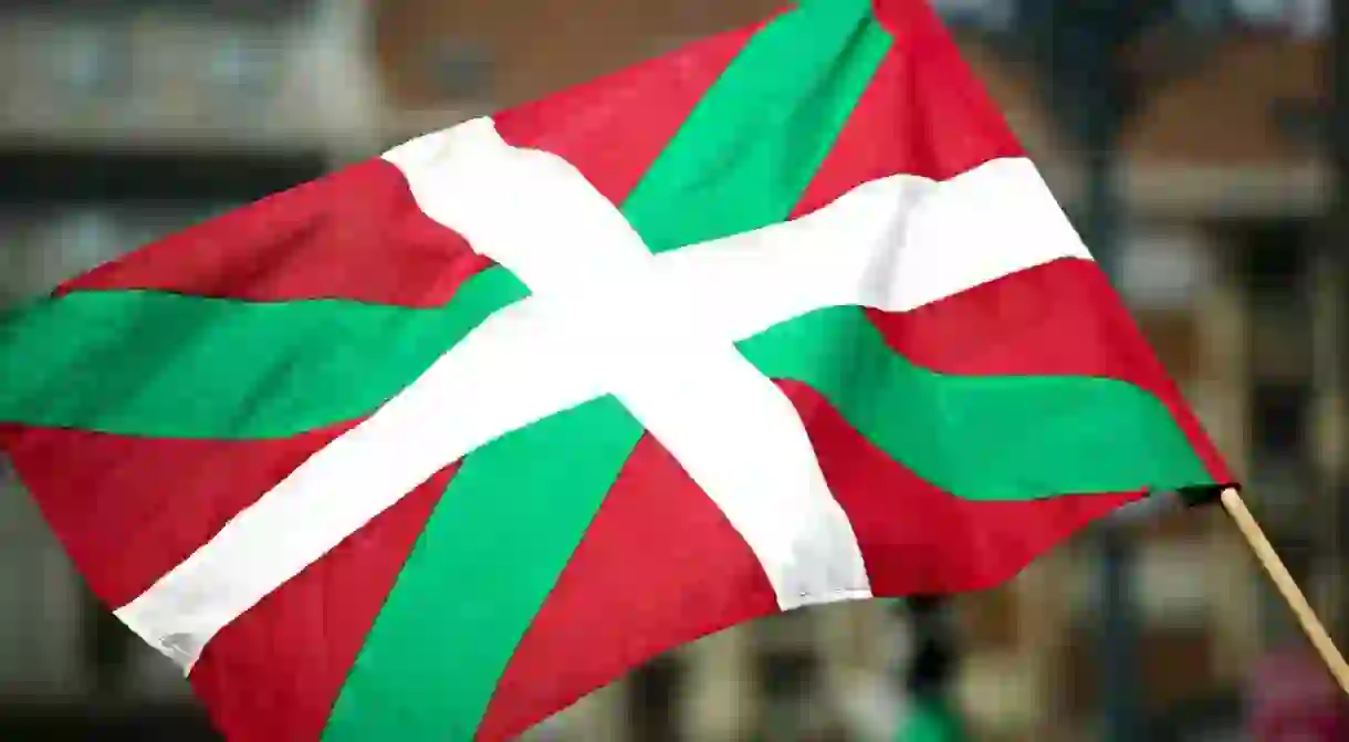 ACAWPE Basque national flag the Ikurrina during political demonstration in central Bilbao