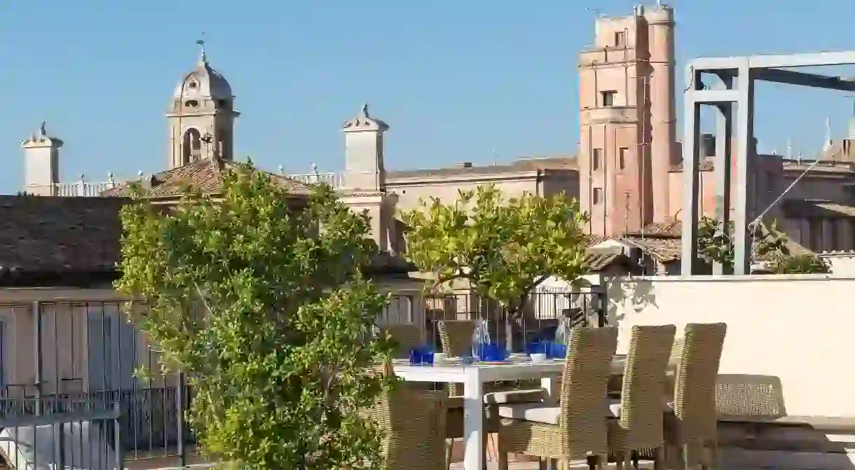 Admire the amazing view from the rooftop terrace of the Piazza Venezia