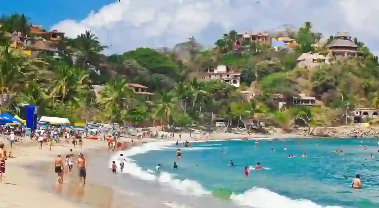 Sayulita village tumbles down the forested Sierra Madre hillsides to golden beaches and the pounding Pacific