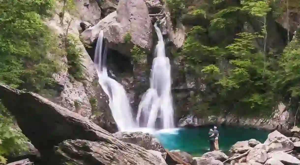 People hike to see a waterfall in the Catskills, New York