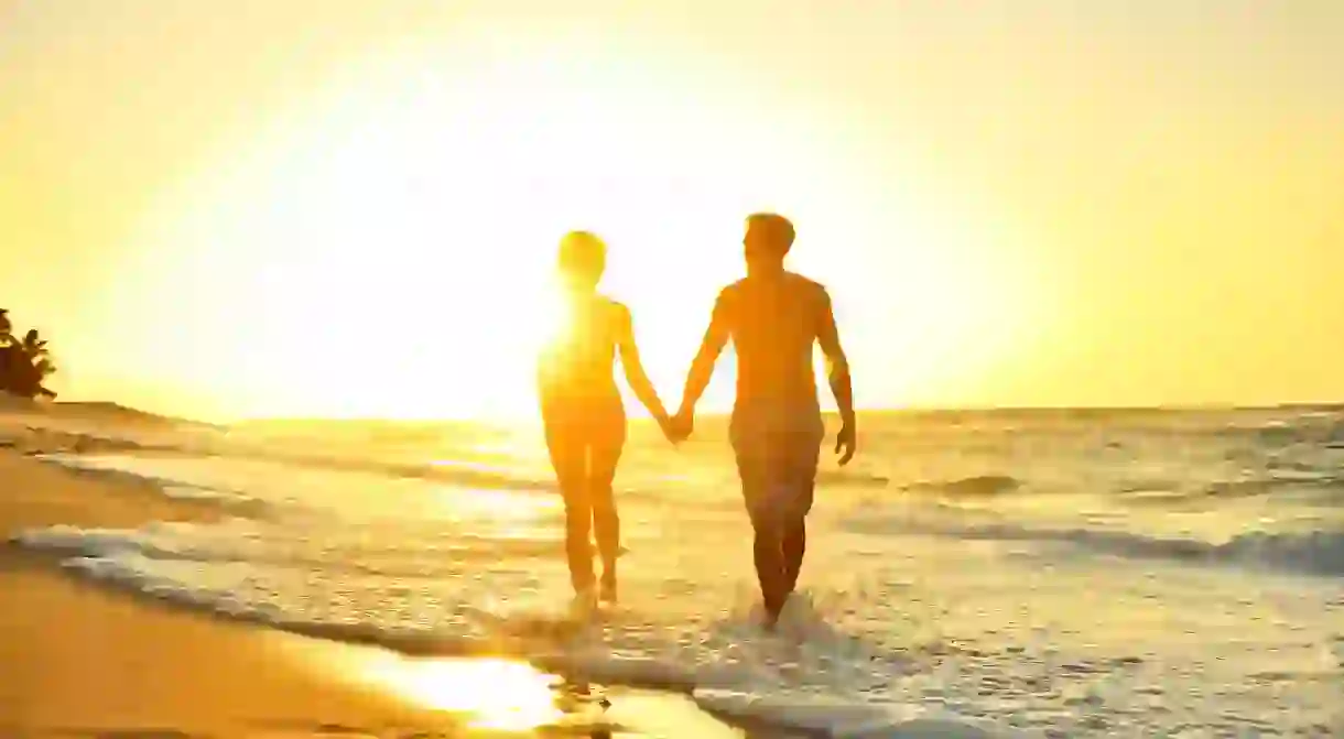 Spend your romantic honeymoon in Oahu and stroll hand in hand down the beach at sunset