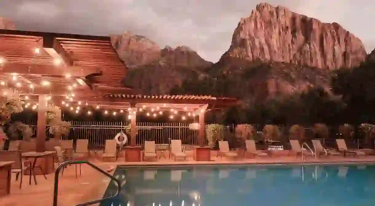 Enjoy poolside views of Zion National Park at the Cable Mountain Lodge in Utah