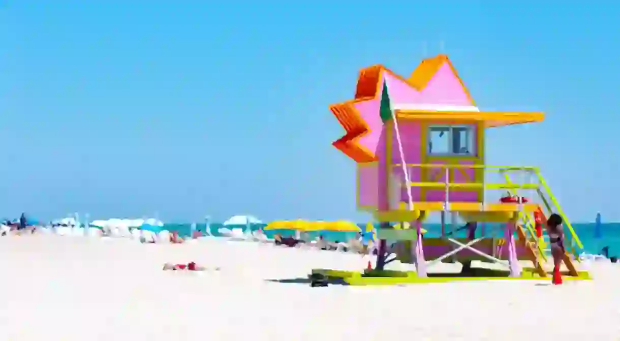 Miami Beachs iconic Art Deco lifeguard towers against a blue Florida sky.