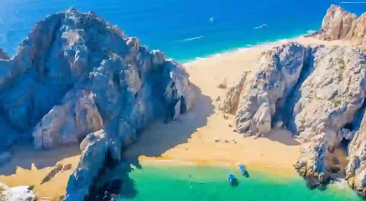 An aerial view of Playa del Amor, where visitors can choose between the calm waters of the Sea of Cortez and the mighty Pacific Ocean