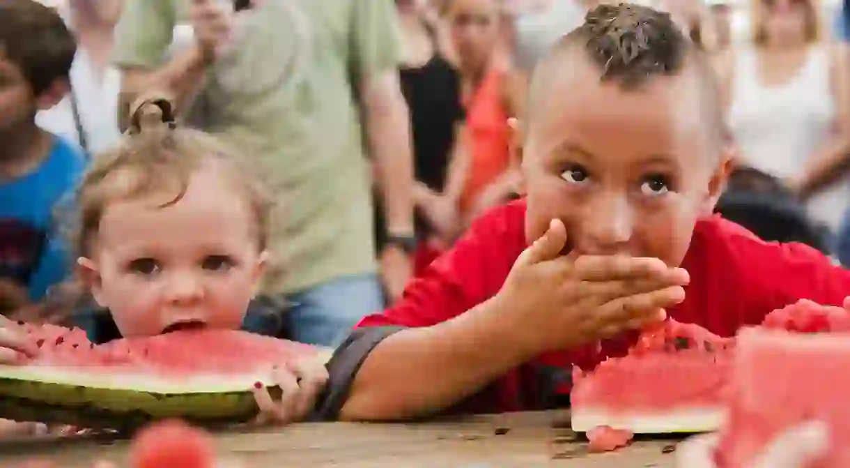 The Luling Watermelon Thump holds watermelon-eating contests for every age group, so grab the whole family