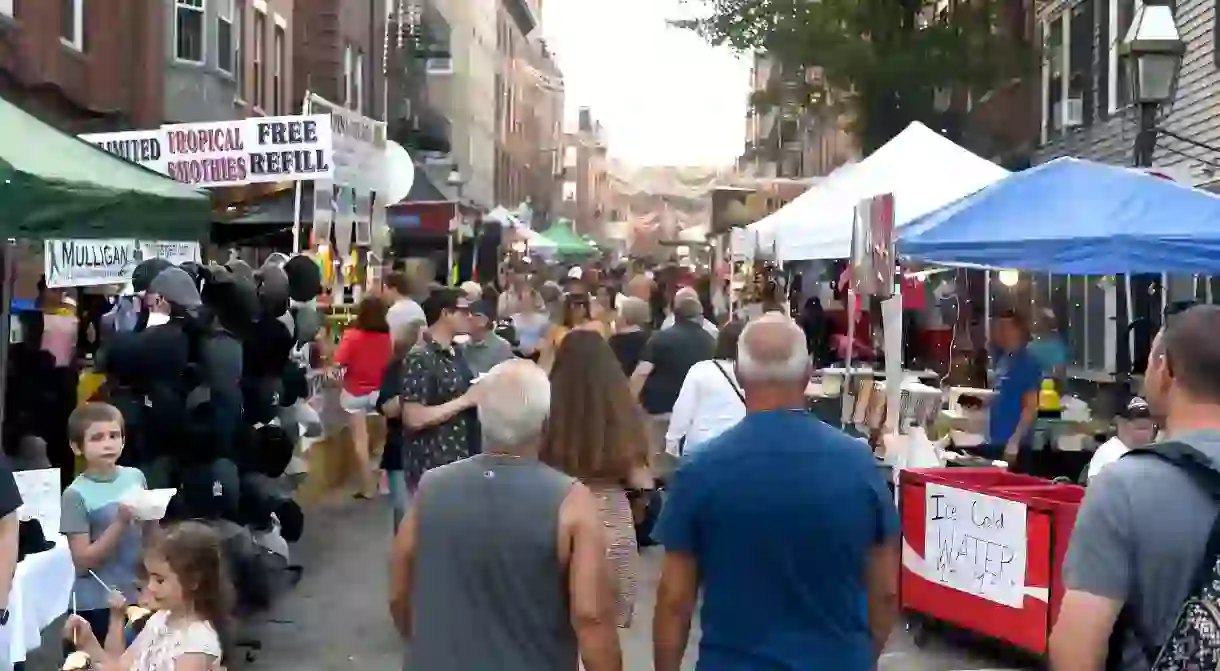 People pack the narrows streets during the annual Fishermans Feast in Bostons North End, a three-month series of festivals celebrating Beantowns Little Italy with delicious food and processions