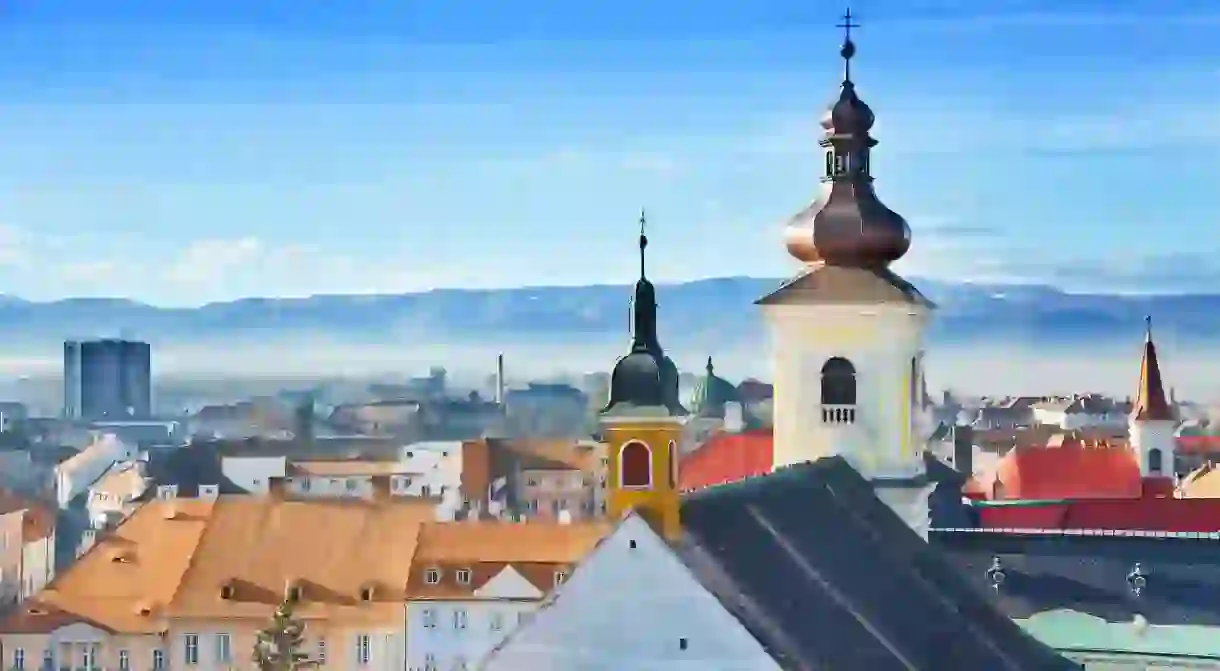 The old town of Sibiu offers both stunning architecture and beautiful mountain scenery