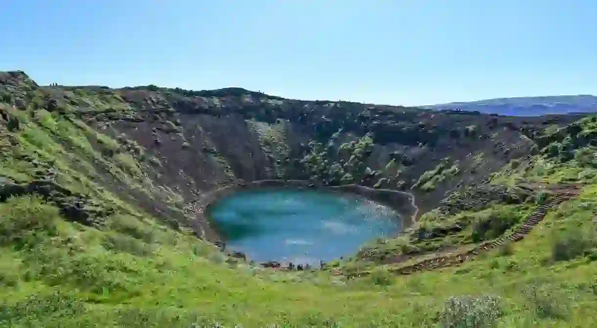 Kerið is a turquoise, water-filled caldera in southern Iceland