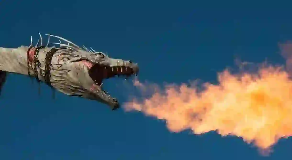 An escaped fire-breathing dragon sits on top of Gringotts bank at the Wizarding World of Harry Potter in Universal Studios Florida