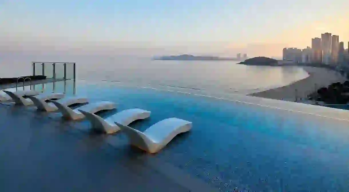 Enjoy panoramic city views from the infinity pool at Signiel Busan