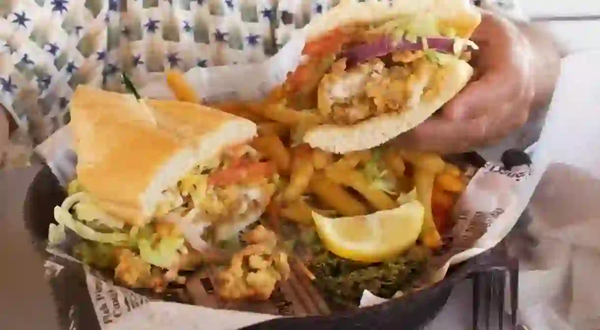 An oyster Po-boy with fries. Traditionally served in Louisiana, Mississippi, and Florida