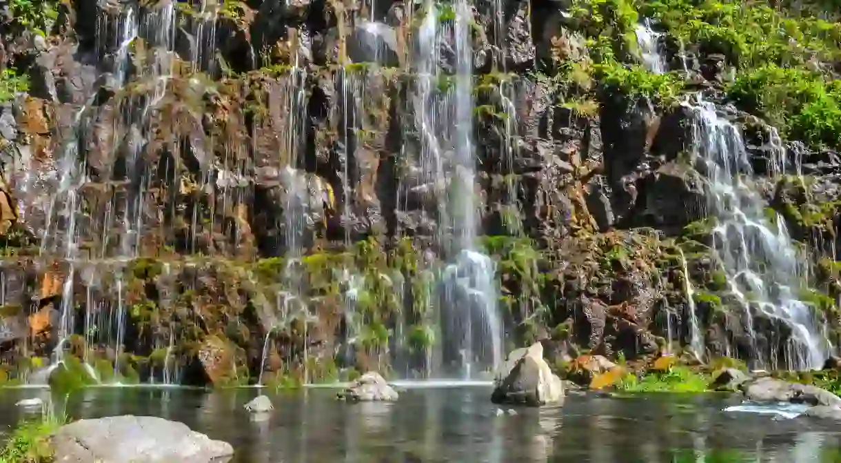 Dashbashi Canyon is a mountain gorge of tumbling waterfalls and steep slopes covered by scattered foliage