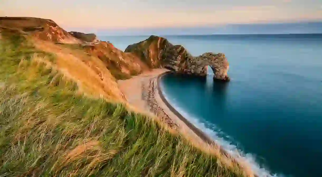 Seeing Durdle Door from a clifftop path is just one of the charms of Dorset’s Jurassic Coast