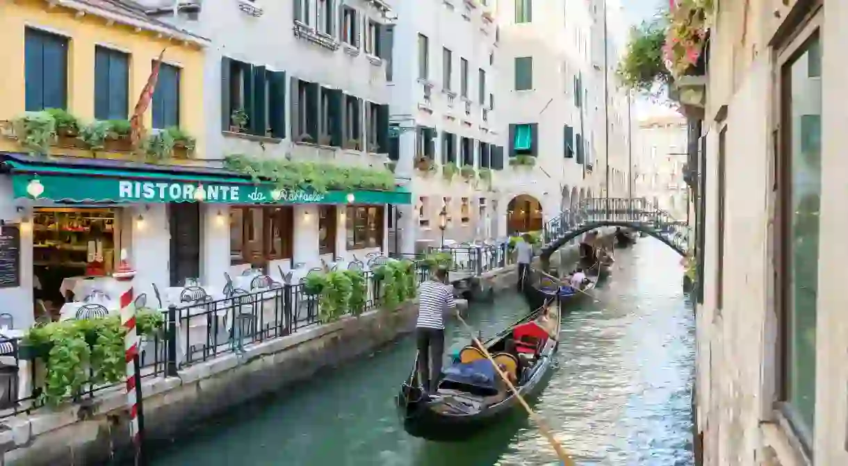 Experiencing a gondola ride around the citys canals is one unmissable thing you can only do in Venice