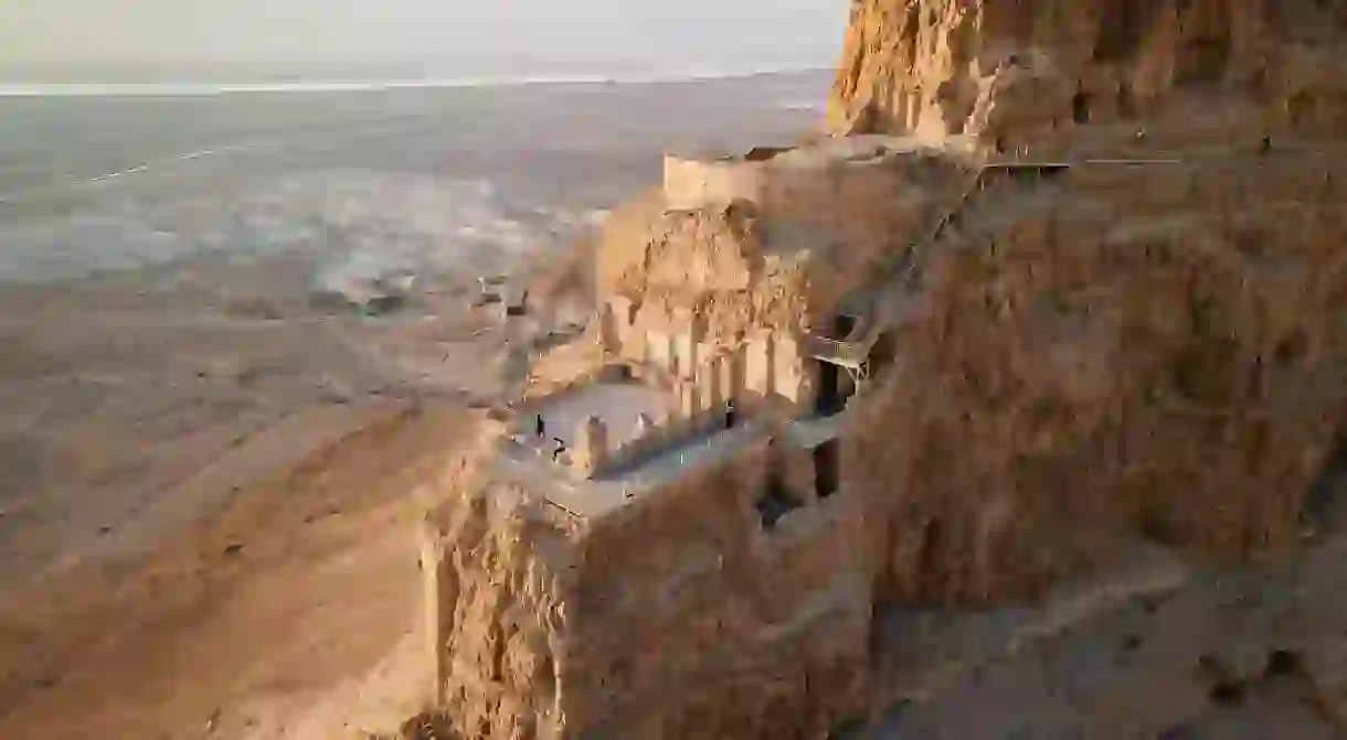 The ruins of Massada, a fortress built by Herod the Great, sit on a cliff-top just inland from the Dead Sea