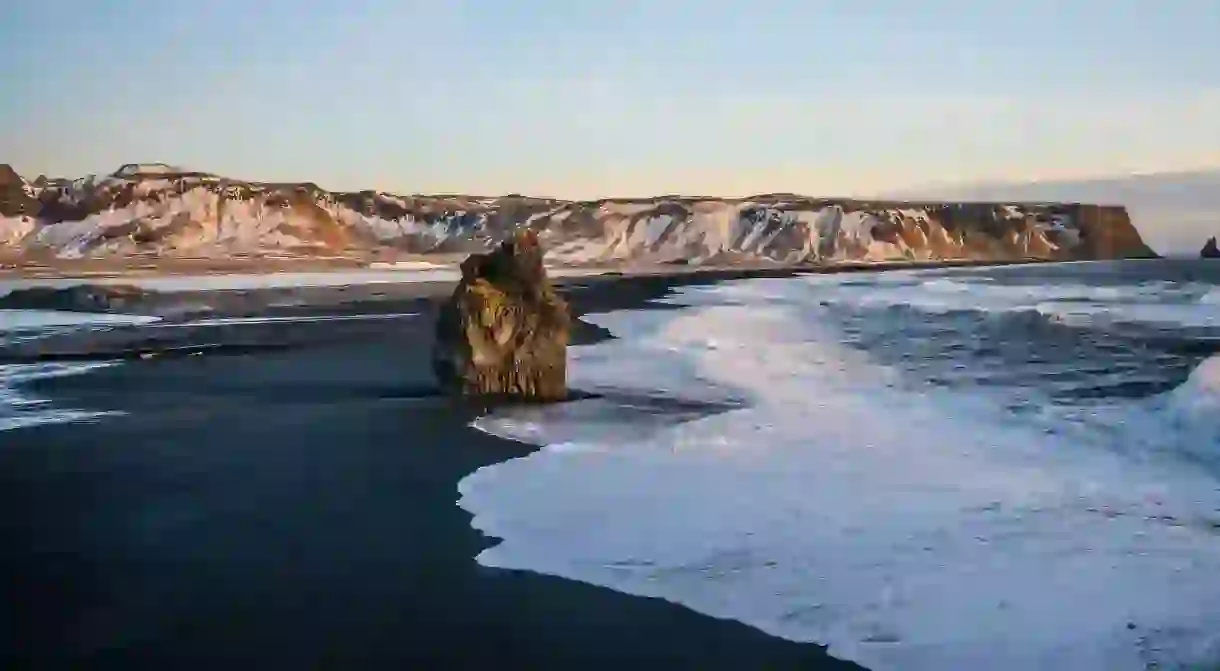 Reynisfjara is the most famous black-sand beach in Iceland and features spectacular basalt stacks