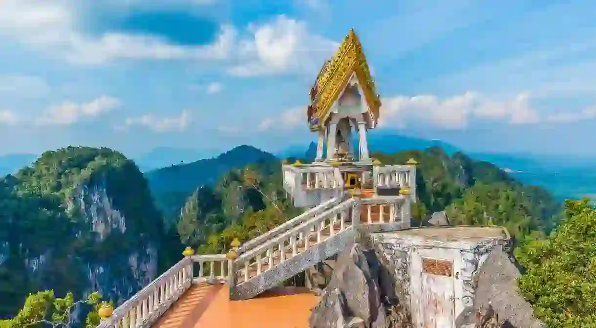 Tiger Cave Temple in Krabi is surrounded by scenic mountains