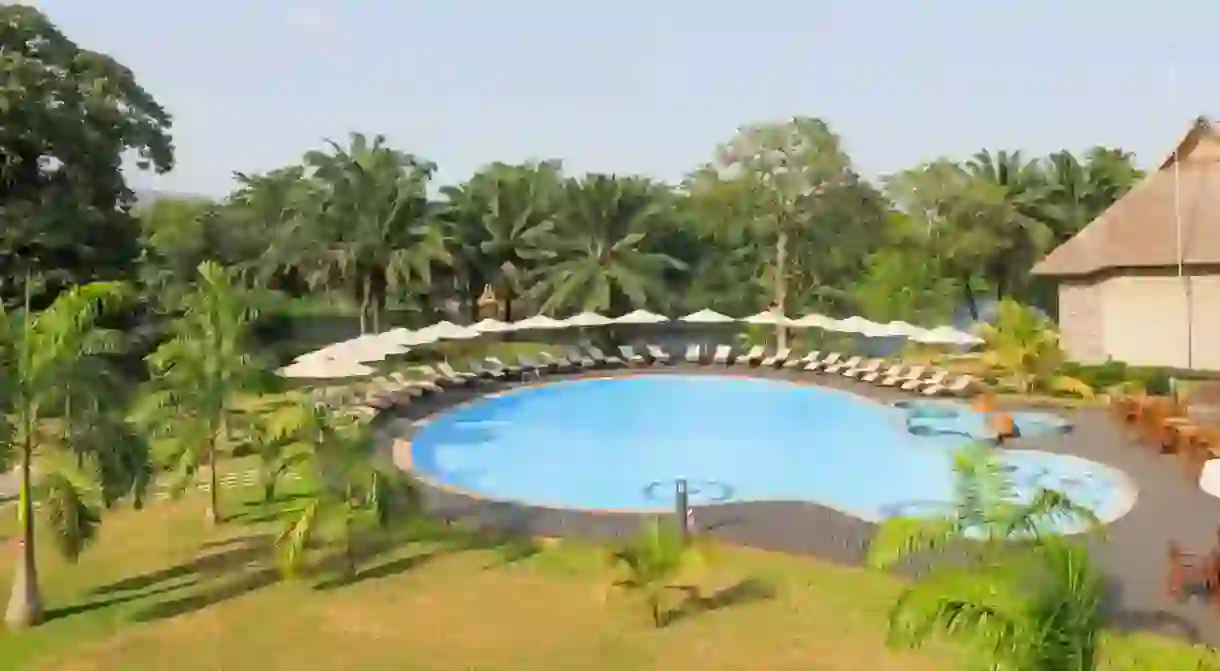 Relax poolside at the Royal Senchi Resort in Akosombo, Ghana