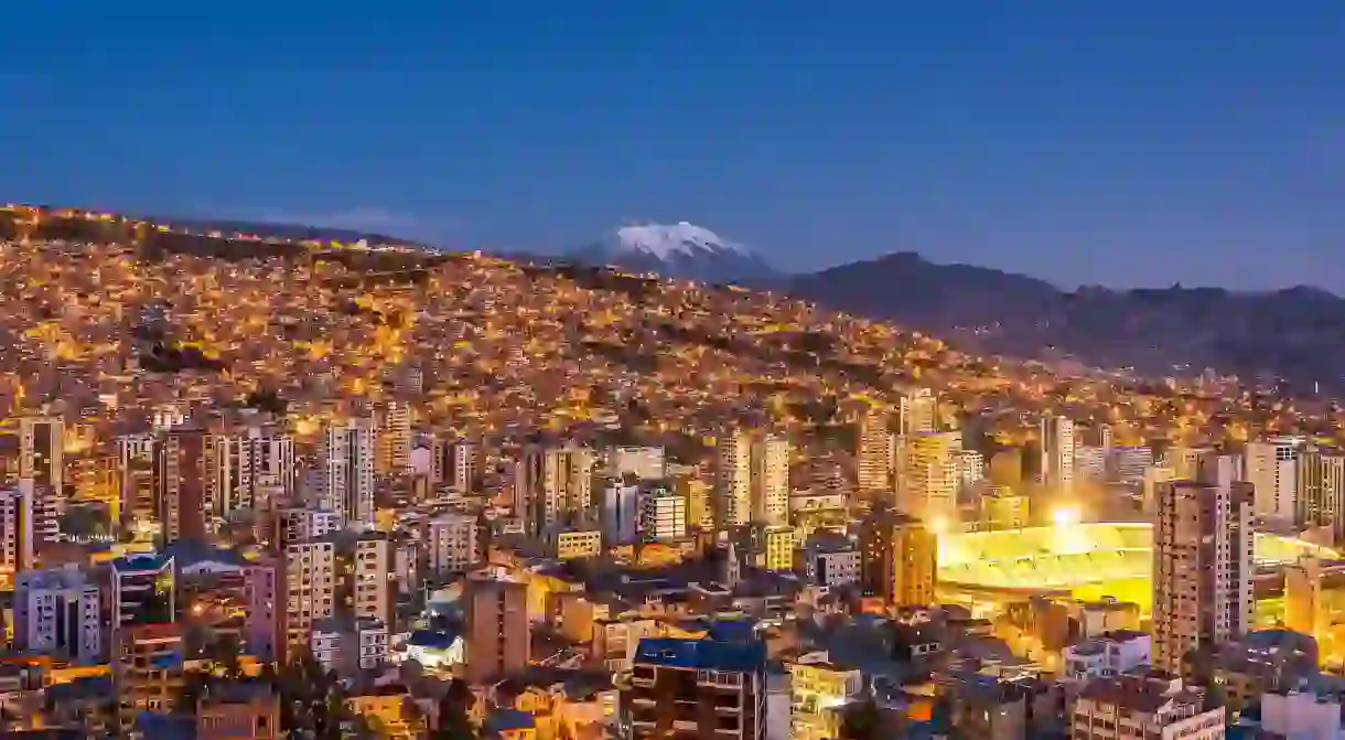 The city of La Paz in Bolivia has a mountainous backdrop that includes Illimani, the highest mountain in the Cordillera Real