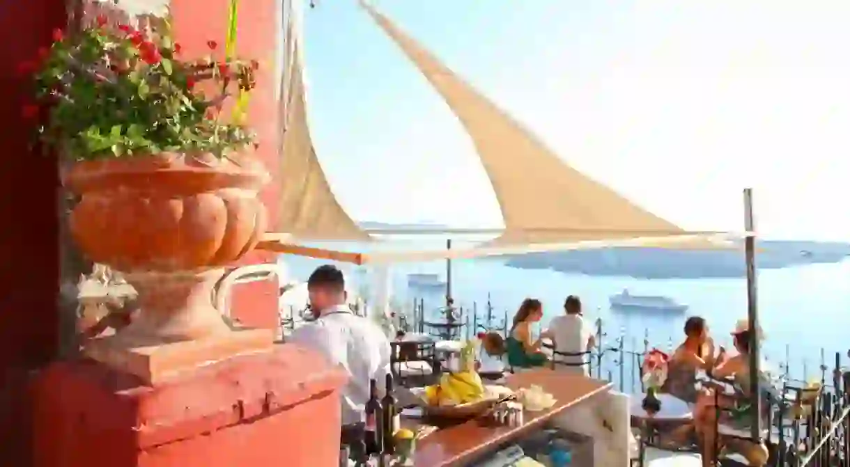 Enjoy cocktails with sea views at the PK Cocktail Bar in Fira, which is open 20 hours a day during peak season