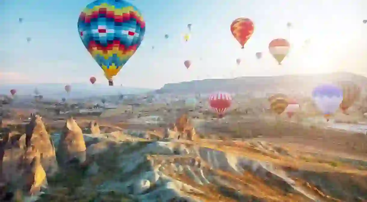 Hot air balloon trips make a romantic and popular way to experience Cappadocias breathtaking landscape