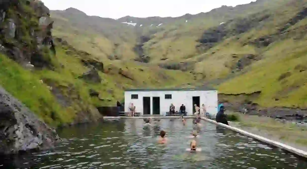 Seljavallalaug is a geothermally heated outdoor swimming pool built into the mountainside