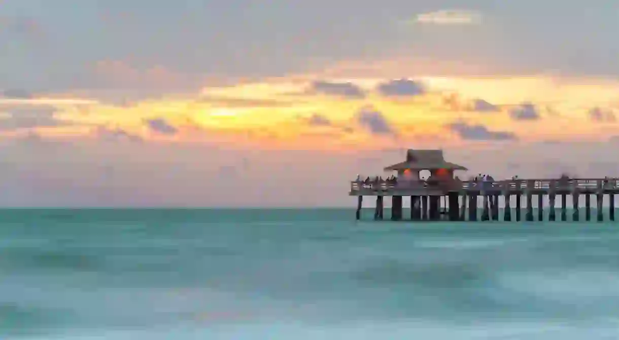 Naples Pier in the Gulf of Mexico is an exceptional place to watch the sunset in Florida