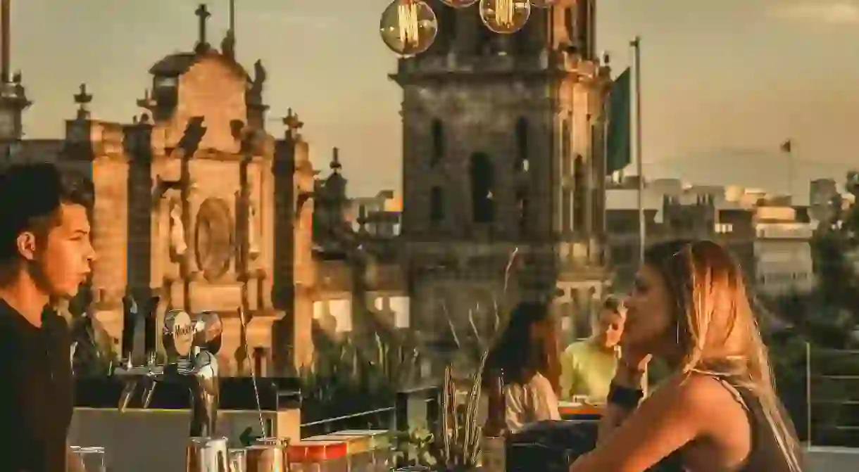 Customers ordering drink at Hostel Mundo Joven Catedral rooftop