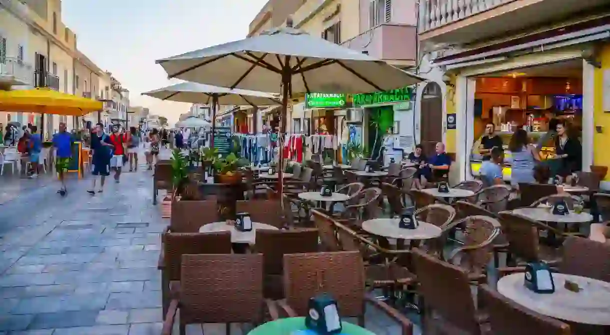 The bustling Via Roma on the island of Lampedusa is home to bars, restaurants and shops