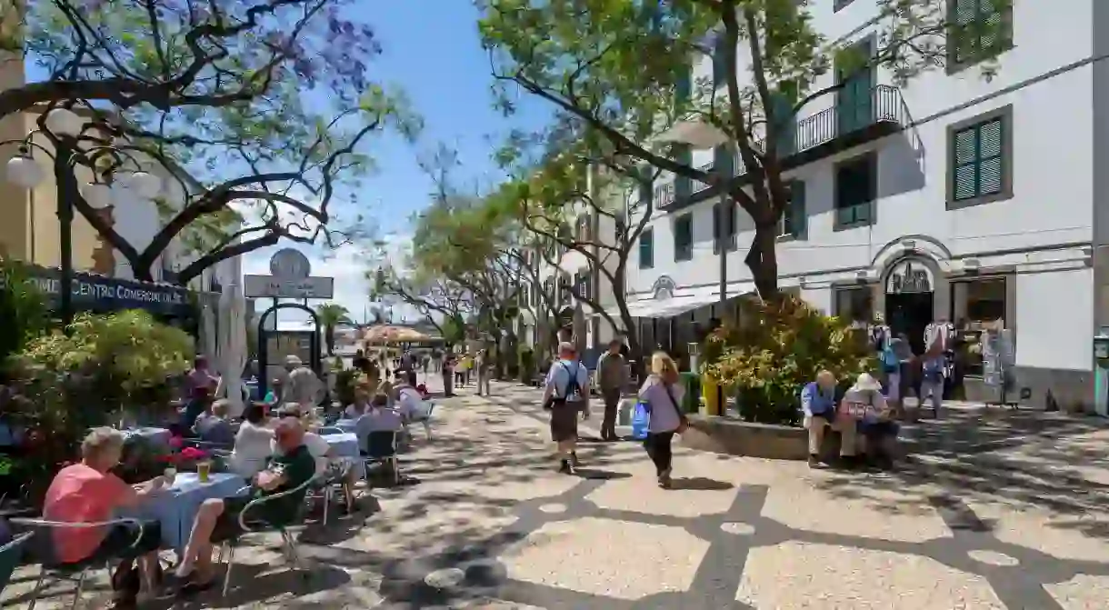 Take a pew at one of the many al fresco restaurants and cafes in Funchal, Madeira, and enjoy a refreshing cocktail or local poncha