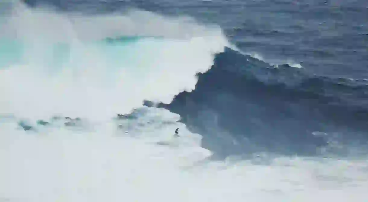 Experience the mega waves in Nazaré, Portugal, or watch the professional surfers take on the challenge as you sit back and enjoy the view